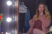 girl puts on lipstick