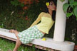 girl on vine bench
